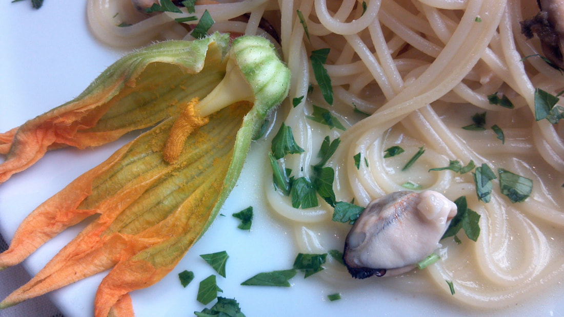 spaghetti with clams and squash blossoms